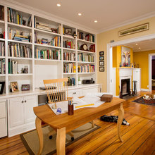 Built in bookshelves around door in office