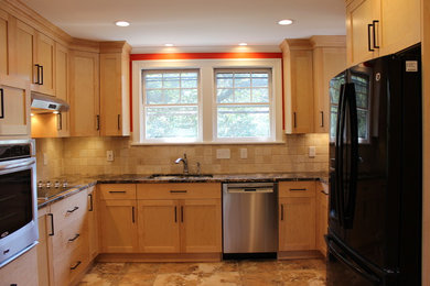 Eat-in kitchen - small traditional u-shaped eat-in kitchen idea in Other with an undermount sink, shaker cabinets, light wood cabinets, granite countertops, beige backsplash, stone tile backsplash, stainless steel appliances and no island