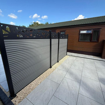 Composite Screen Panels Along a Porcelain Terrace