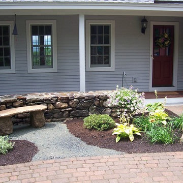 Stone wall and stone bench near entry