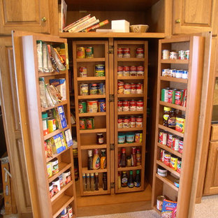 Traditional kitchen pantry designs - Inspiration for a timeless l-shaped medium tone wood floor kitchen pantry remodel in Indianapolis with a double-bowl sink, recessed-panel cabinets, medium tone wood cabinets, brown backsplash, cement tile backsplash and an island