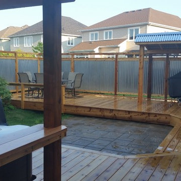 Cedar Backyard - Covered Hot tub, Galvanized steel fence and U shaped Deck.