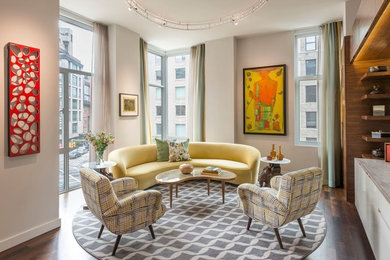 Mid-sized 1950s formal and loft-style dark wood floor living room photo in New York with gray walls and a wall-mounted tv
