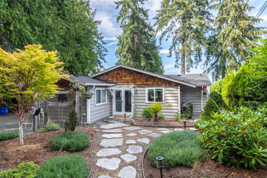 Beach style home design photo in Calgary