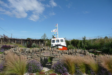 This is an example of a beach style garden in Edinburgh.