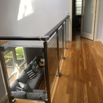 Modern railing system with tempered glass panels NJ