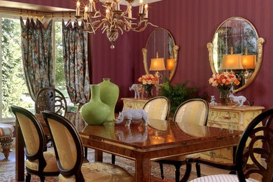 Enclosed dining room - traditional enclosed dining room idea in St Louis with red walls