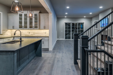Inspiration for a mid-sized transitional wooden straight wood railing staircase remodel in Denver with carpeted risers