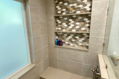 Mid-sized transitional master beige tile and porcelain tile porcelain tile, beige floor, double-sink and vaulted ceiling walk-in shower photo in Miami with flat-panel cabinets, white cabinets, a one-piece toilet, white walls, an undermount sink, quartz countertops, a hinged shower door, beige countertops, a niche and a built-in vanity