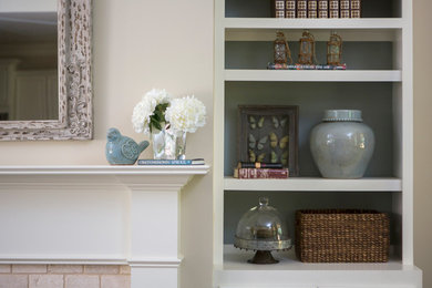 Inspiration for a mid-sized contemporary open concept living room remodel in Nashville with beige walls, a standard fireplace and a stone fireplace