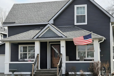 Elegant two-story vinyl and clapboard exterior home photo