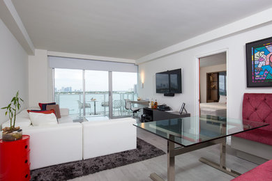 Living room - small contemporary open concept porcelain tile and gray floor living room idea in Miami with white walls, no fireplace and a wall-mounted tv