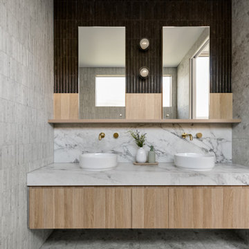 Havenwood House | Luxurious bathroom with natural stone