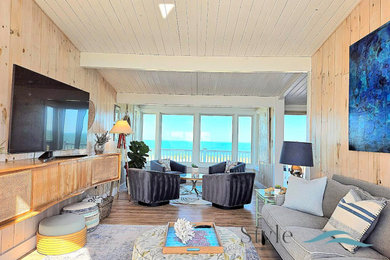 Example of an island style living room design in Philadelphia