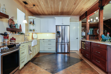 Example of a mid-sized country l-shaped concrete floor open concept kitchen design in Raleigh with a farmhouse sink, shaker cabinets, granite countertops, stainless steel appliances, an island and white cabinets