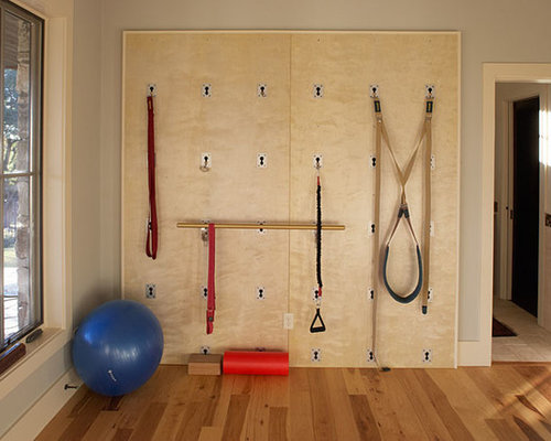 Eclectic Home Gym Tampa Example of a small eclectic home yoga studio design in Austin with gray walls and light