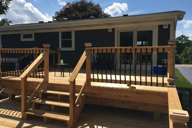 Mid-sized elegant backyard deck photo in Chicago with no cover