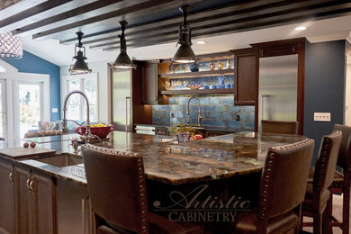 Traditional kitchen in New York with flat-panel cabinets and dark wood cabinets.