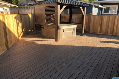 This is an example of a large backyard deck in Vancouver.