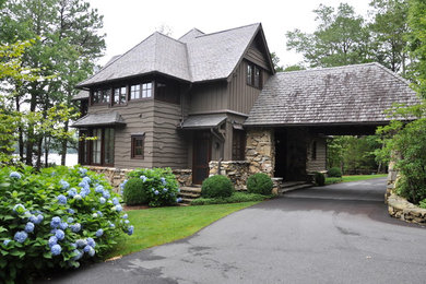 Large craftsman gray three-story wood exterior home idea in Atlanta with a hip roof