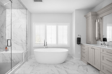 Bathroom - large contemporary master white tile and porcelain tile porcelain tile, gray floor and double-sink bathroom idea in Detroit with recessed-panel cabinets, gray cabinets, a one-piece toilet, gray walls, an undermount sink, quartz countertops, a hinged shower door, white countertops, a niche and a built-in vanity