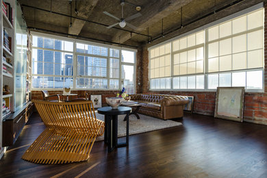 Inspiration for an industrial living room library remodel in Houston