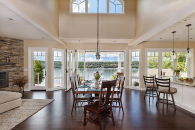 Design ideas for a transitional open plan dining in New York with beige walls, dark hardwood floors and brown floor.