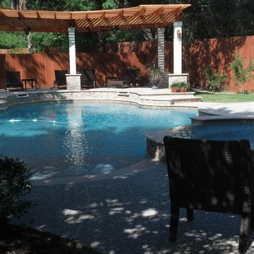 Freeform Travertine Pool with Raised Decking & Oversized Spa & Firepit Area