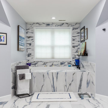 Bathroom remodeling in Columbia, MD with double vanity & marble bathtub