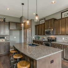 Kitchen - Grey Granite and Dark Wood Cabinets