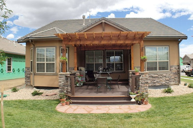 Inspiration for a small timeless backyard deck remodel in Denver with a pergola