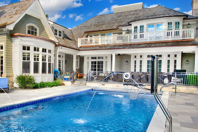 Hot tub - mid-sized traditional backyard stone and rectangular lap hot tub idea in Chicago