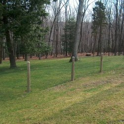 Weld Wire on Round Wood Posts - Home Fencing And Gates