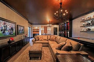 Photo of a traditional family room in Tampa with grey walls, dark hardwood floors, no fireplace and brown floor.