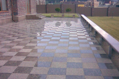 A natural stone Laying granite tiles outdoors