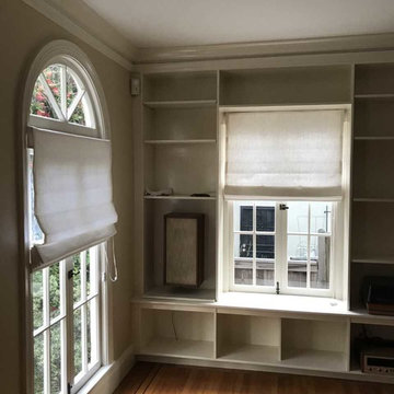 Roman shades mounted below arch