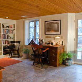 Inspiration for a medium sized contemporary walk-out basement in Manchester with white walls and ceramic flooring.