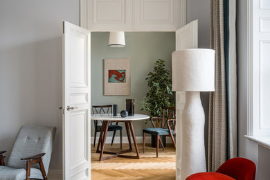 Inspiration for a small eclectic formal enclosed living room in London with grey walls, light hardwood flooring, beige floors and a drop ceiling.