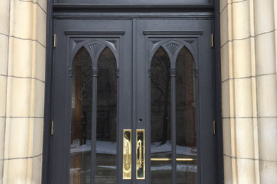 Design ideas for a mid-sized traditional front door in Ottawa with grey walls, a double front door and a black front door.