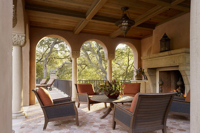 Example of a tuscan patio design in San Francisco with a fire pit