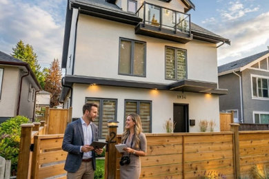 Inspiration for a small three-story stucco exterior home remodel in Vancouver