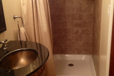 Example of a small classic 3/4 beige tile and porcelain tile limestone floor and beige floor bathroom design in New York with furniture-like cabinets, light wood cabinets, a two-piece toilet, beige walls, an undermount sink and granite countertops
