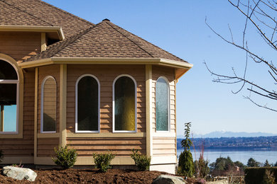 Minimalist beige one-story wood exterior home photo in Seattle