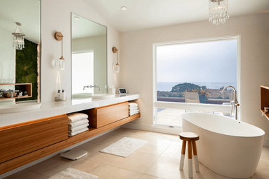 Inspiration for a large transitional master porcelain tile, beige floor and double-sink freestanding bathtub remodel in San Diego with flat-panel cabinets, brown cabinets, white walls, a vessel sink, marble countertops, white countertops and a floating vanity