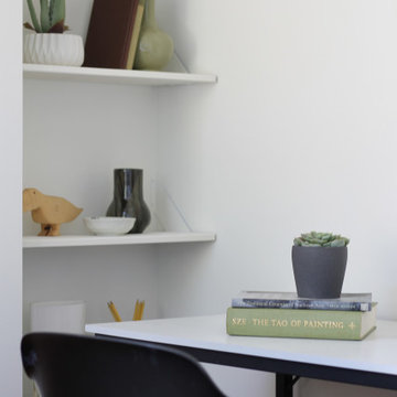 Simple Bookshelf Styling in Green Bedroom