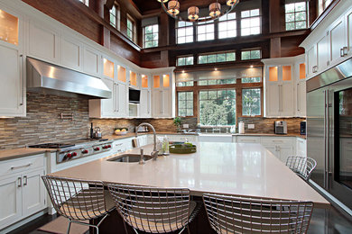 Example of a trendy kitchen design in New York with matchstick tile backsplash and stainless steel appliances