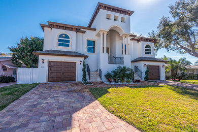 Large mediterranean exterior home idea in Tampa