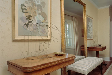 Hallway - large transitional dark wood floor hallway idea in New York with beige walls