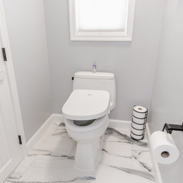 Bathroom remodeling in Columbia, MD with double vanity & marble bathtub