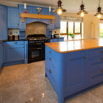 Painted kitchen in Lulworth Blue 89, Oak island worktop and Jet